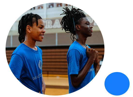 Chicago Positive Impact youth athletes standing together in the gym